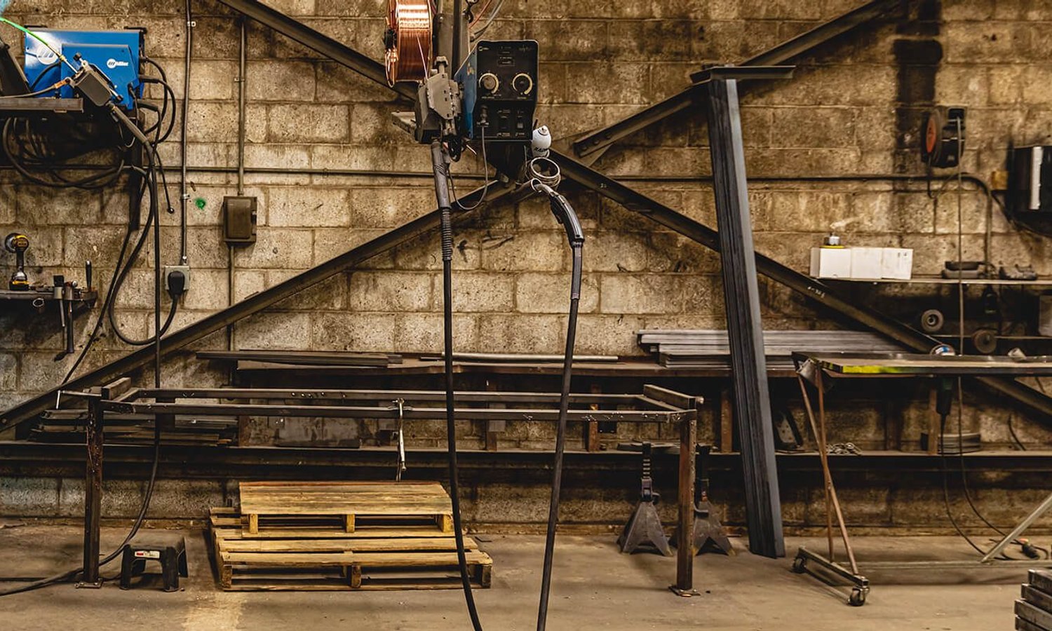 Welder fabricating a steel structure in an engineering workshop